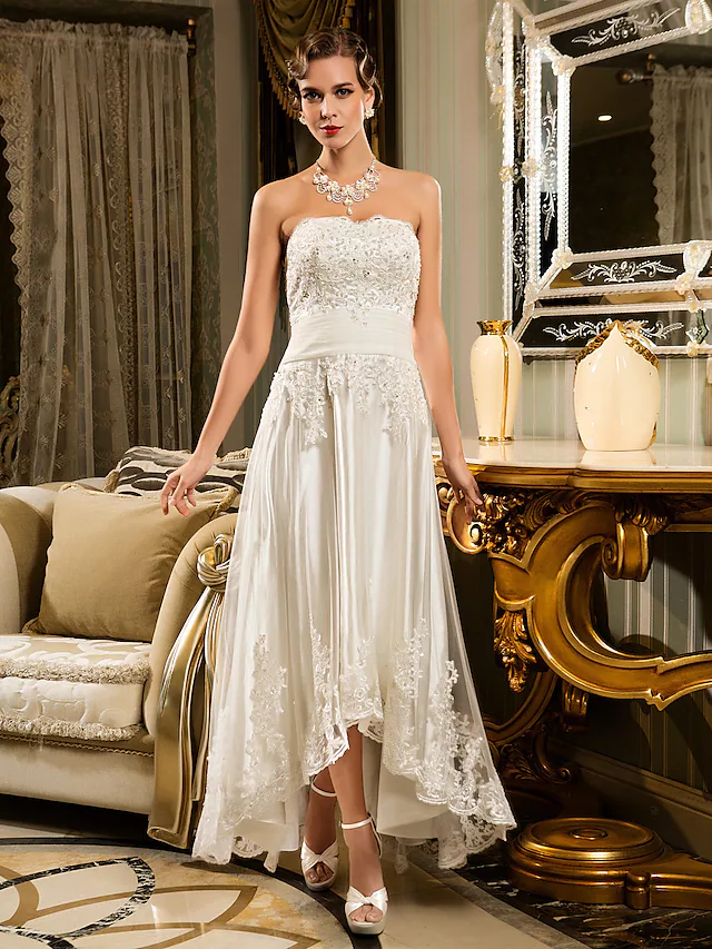 A-Line strapless wedding dress with beaded lace and illusion details.