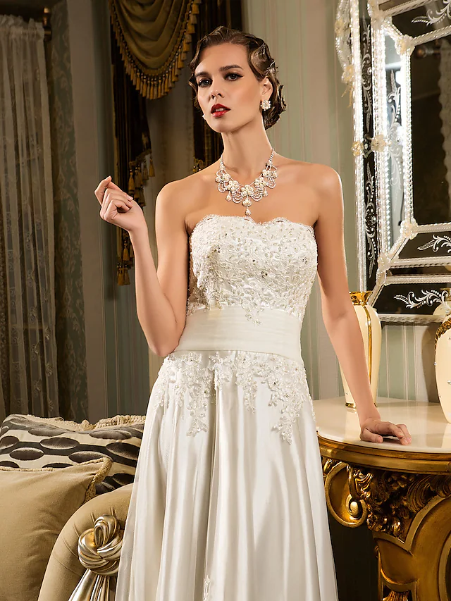 Full length view of a vintage-inspired strapless wedding dress.