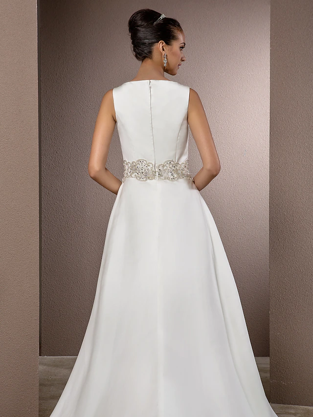 Bride posing in vintage style wedding gown.